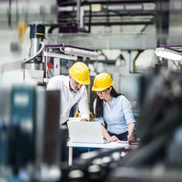 manufacturing floor manager performing quality control in the facility